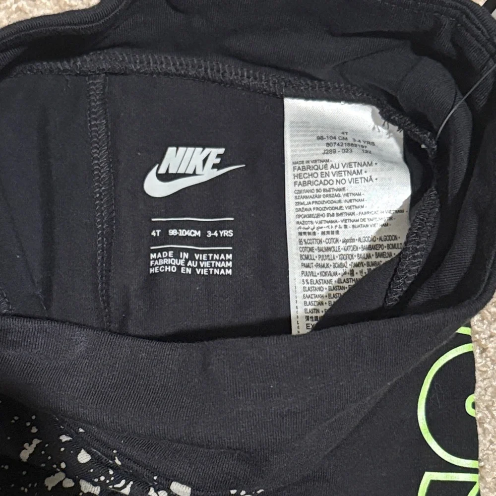 Nike Kids Black Leggings with White Speckles and Neon Green Logo - Picture 3 of 5